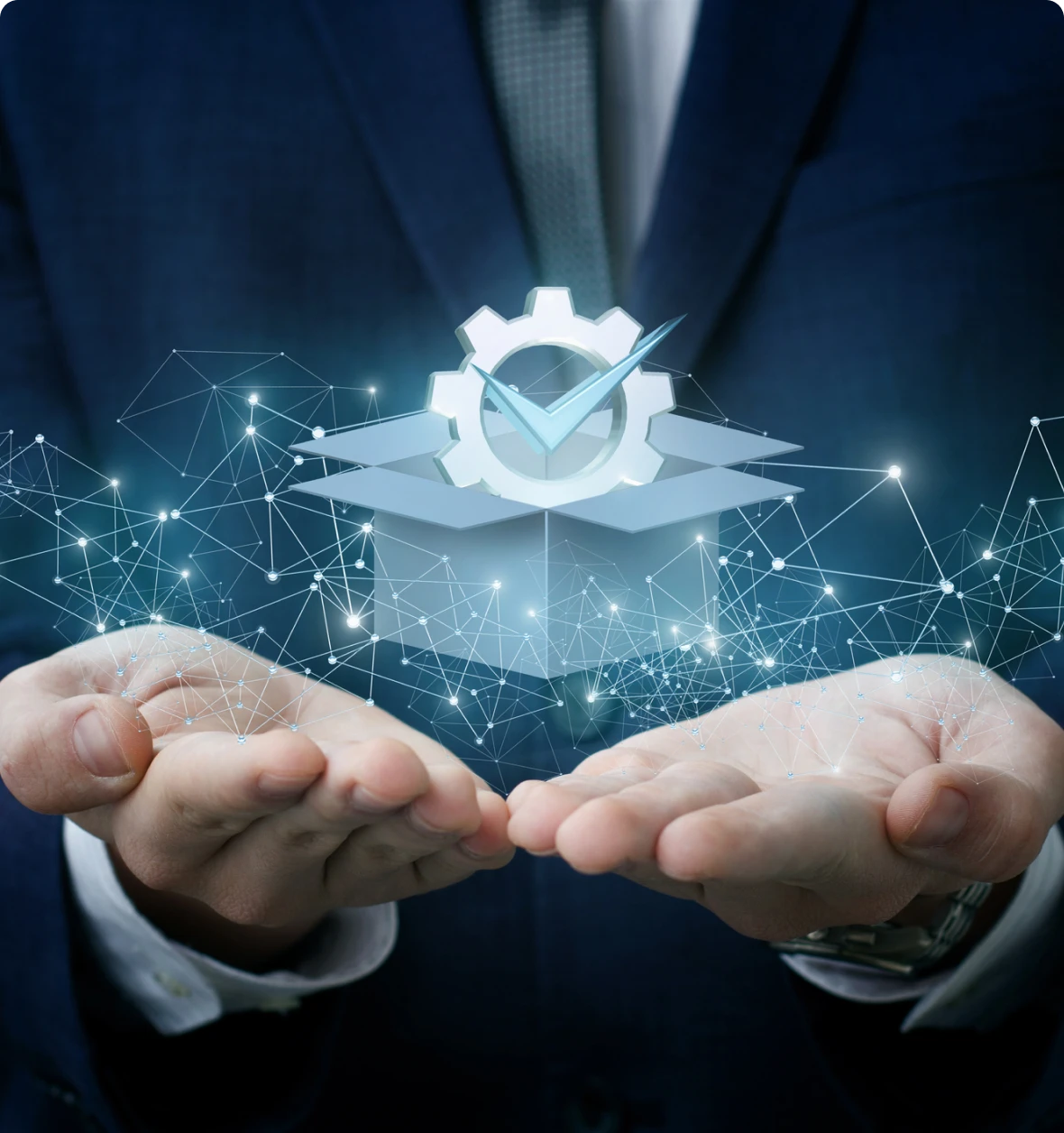 Businessman holding digital gear and checkmark